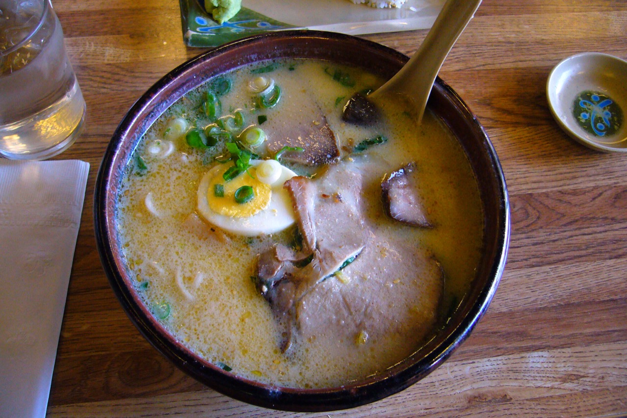 A bowl of miso ramen with rich brown broth and toppings