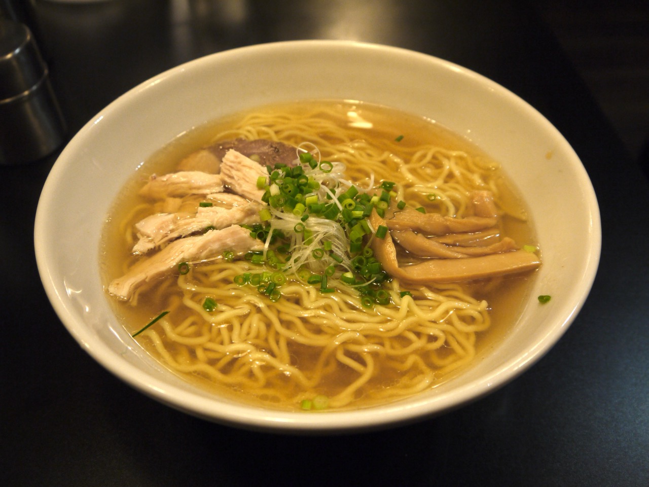 A bowl of shio (salt) ramen with clear, light broth